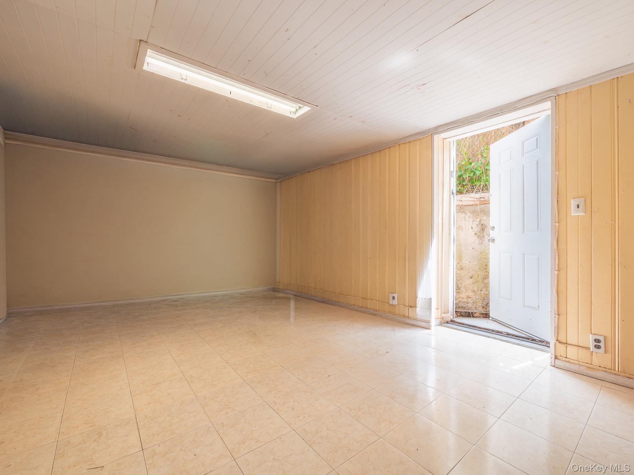 75-75 180th Street Queens, NY 11366 - Photo 32 of 48 a view of an empty room with a window