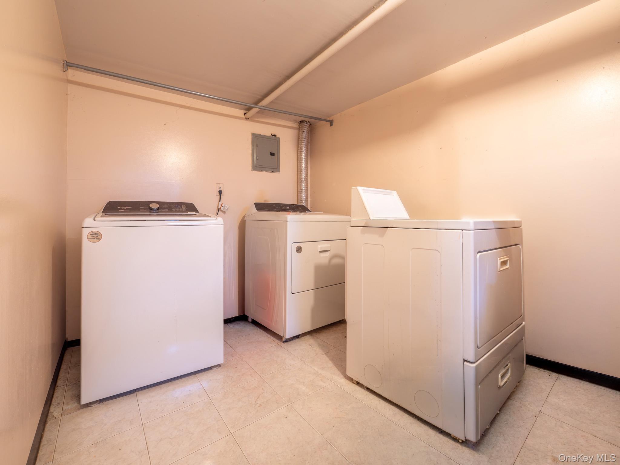 75-75 180th Street Queens, NY 11366 - Photo 33 of 48 a utility room with dryer and washer