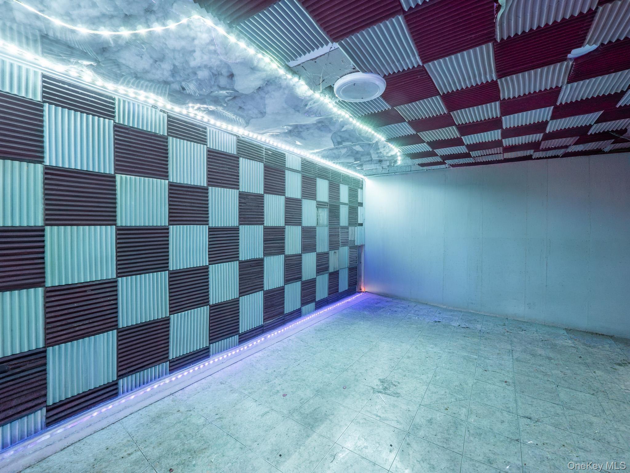 75-75 180th Street Queens, NY 11366 - Photo 36 of 48 a view of a room with a black white checkered floor