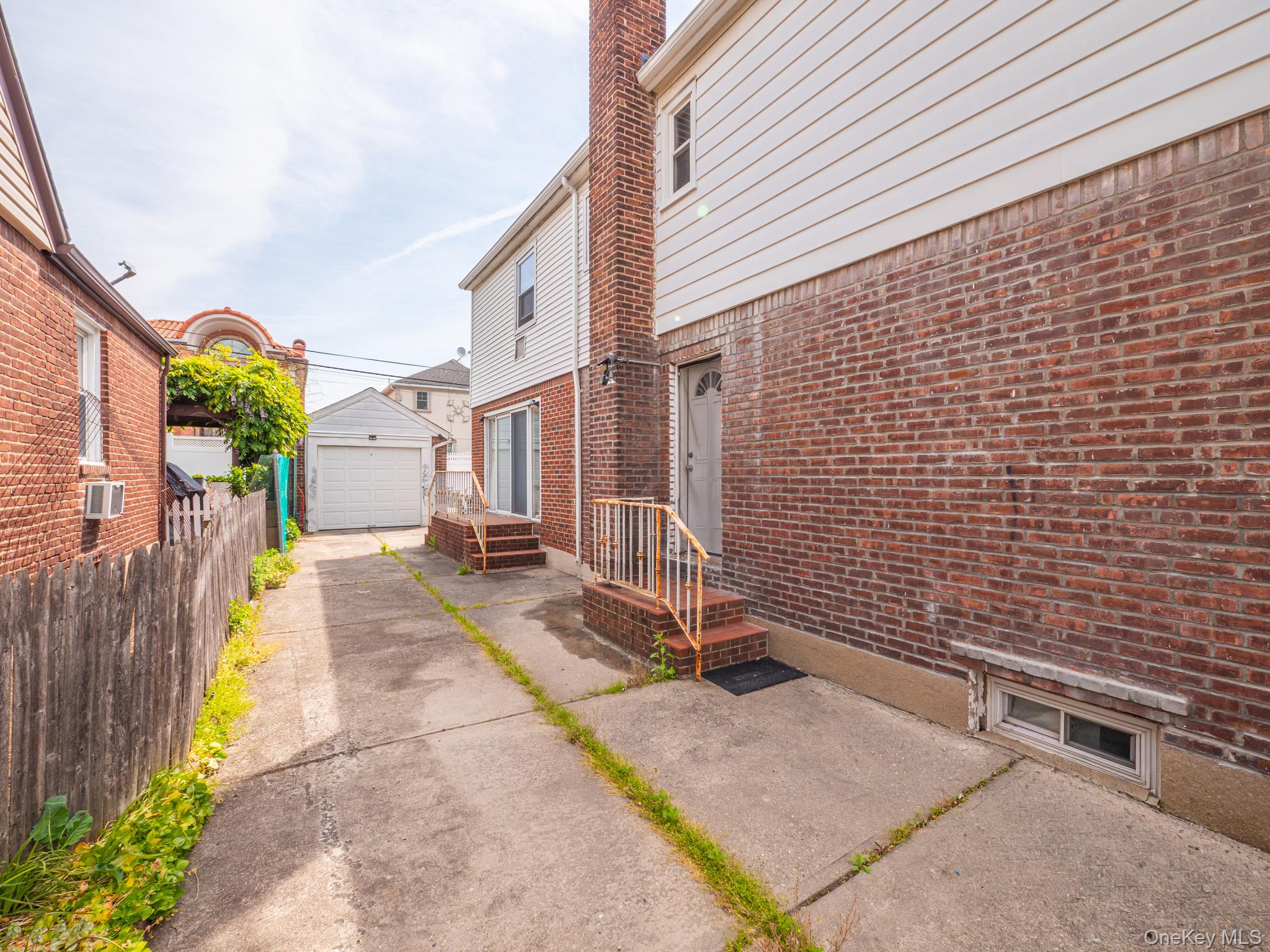 75-75 180th Street Queens, NY 11366 - Photo 37 of 48 a view of a brick house with many windows