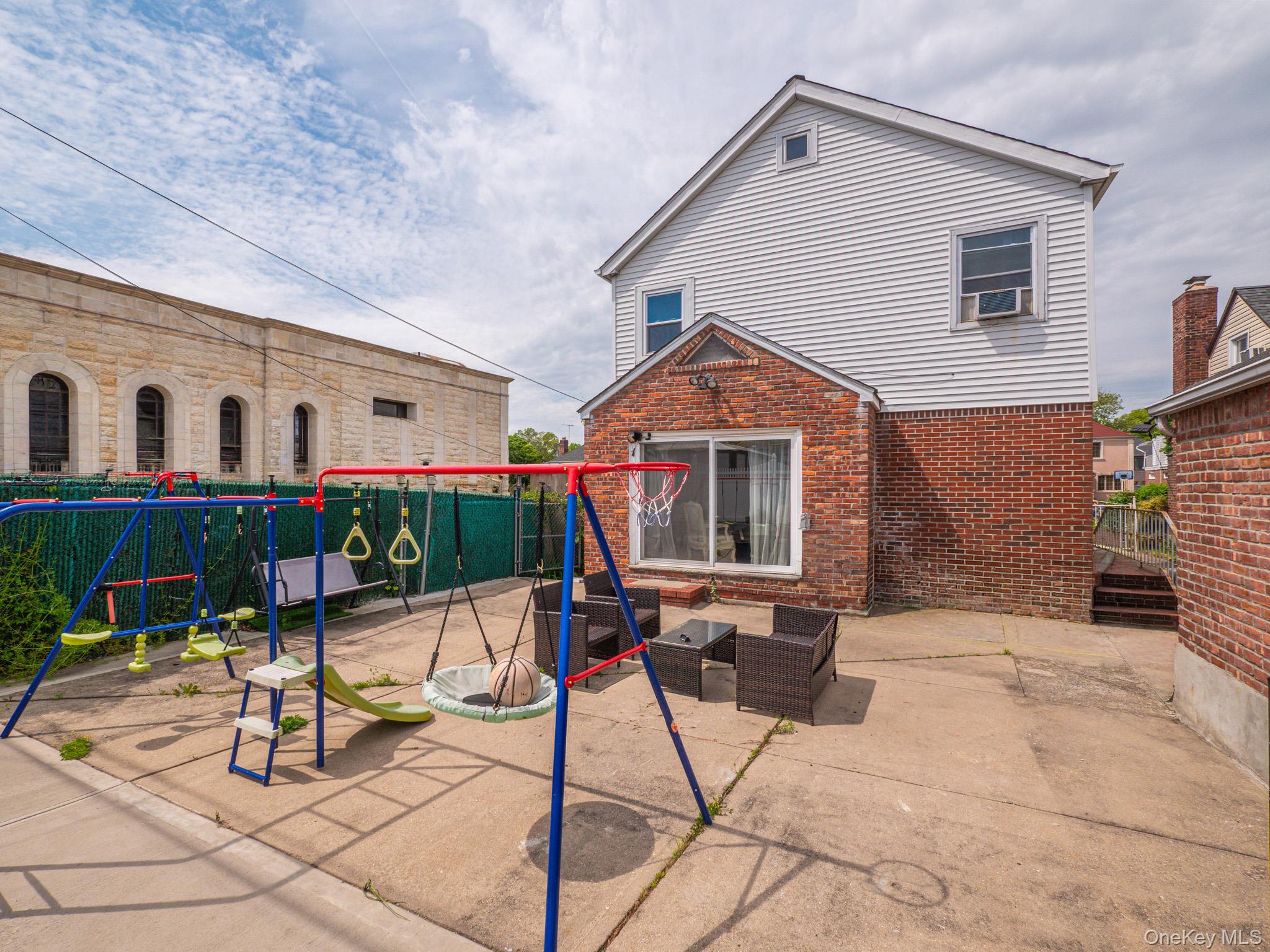 75-75 180th Street Queens, NY 11366 - Photo 39 of 48 a view of house with yard outdoor seating and entertaining space