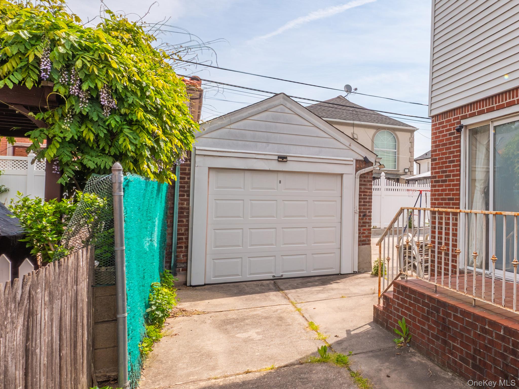 75-75 180th Street Queens, NY 11366 - Photo 40 of 48 a house with a outdoor space
