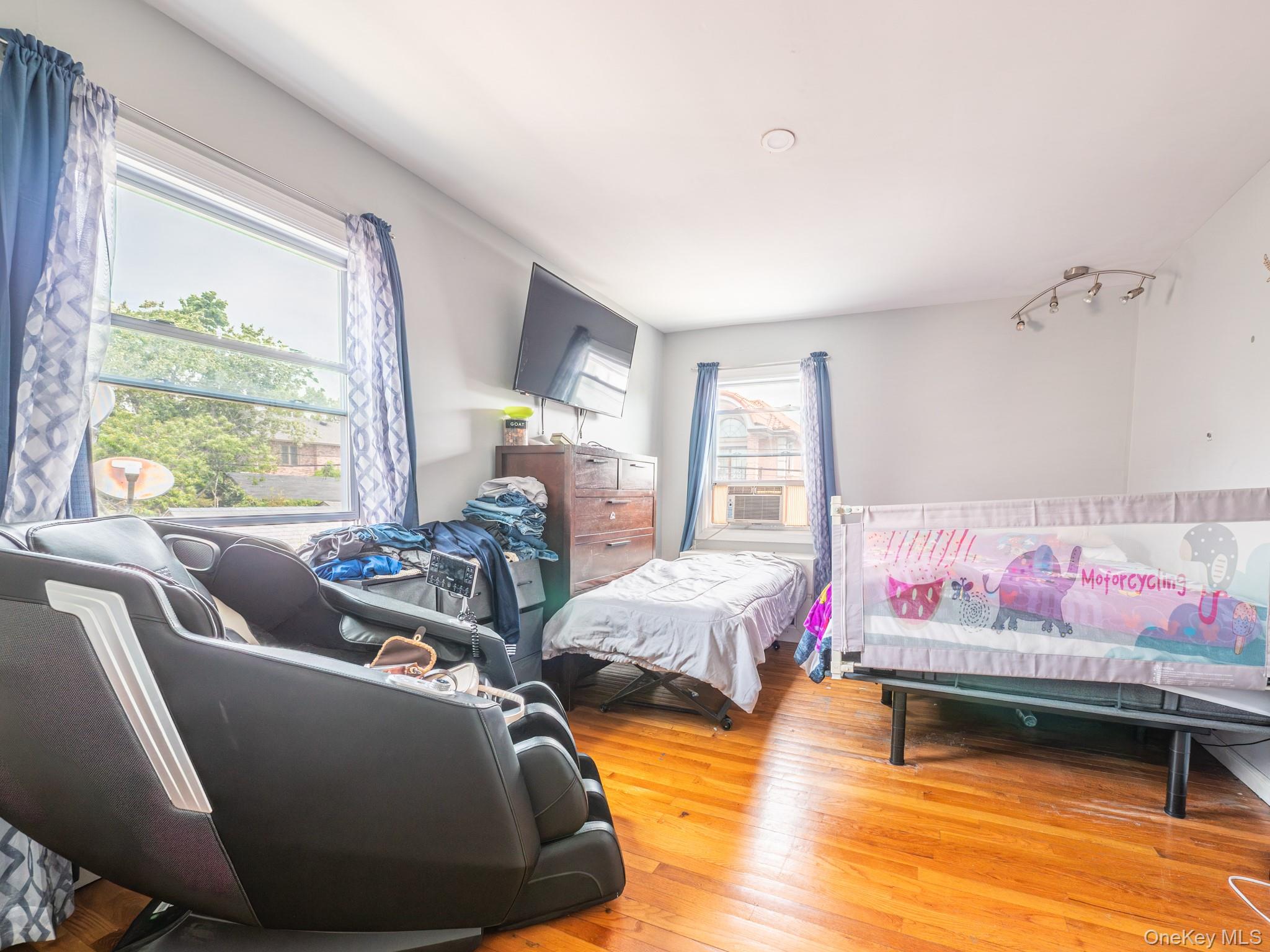 75-75 180th Street Queens, NY 11366 - Photo 43 of 48 a living room with furniture and a table