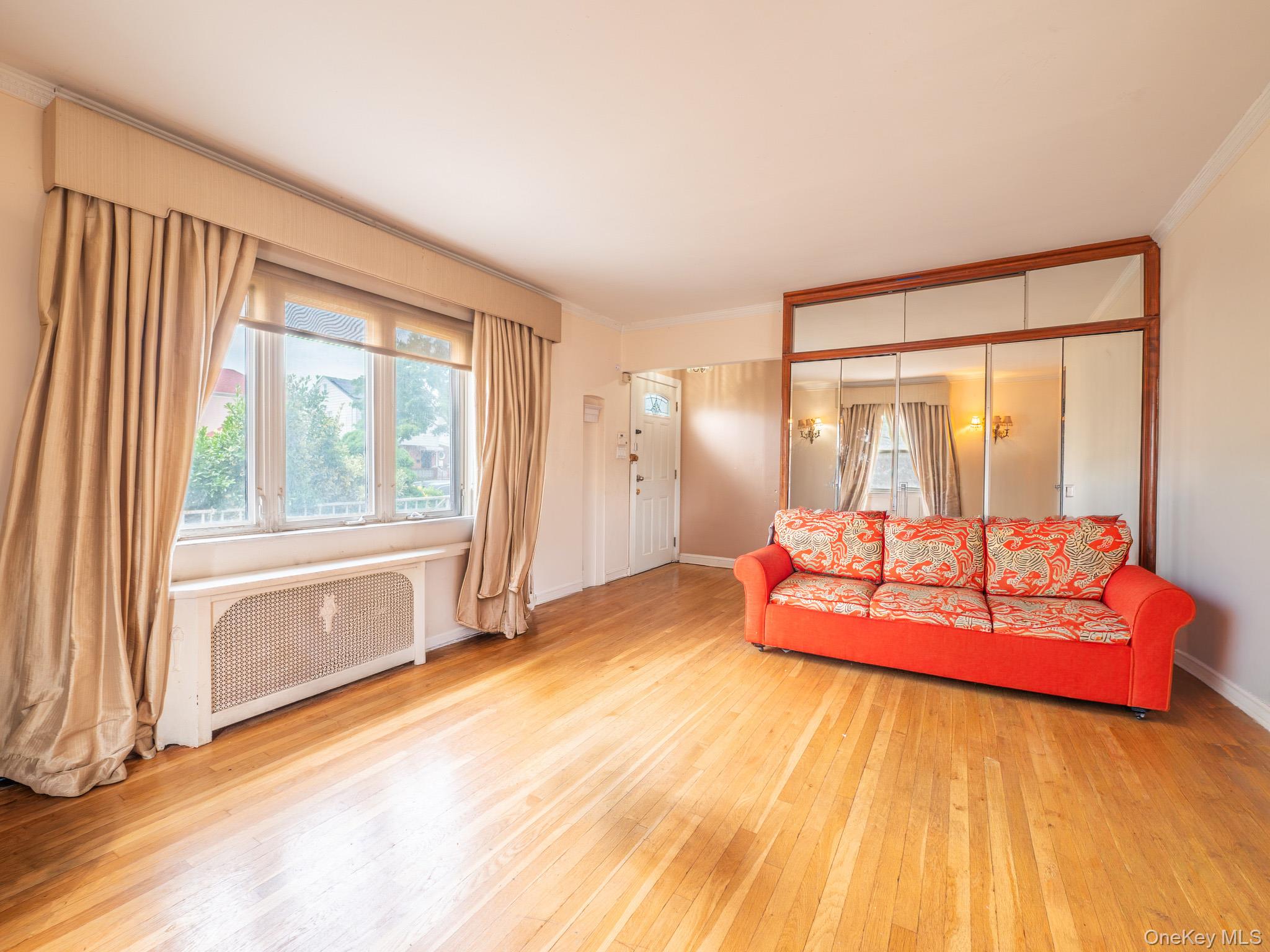 75-75 180th Street Queens, NY 11366 - Photo 8 of 48 a spacious bedroom with a bed and glass door