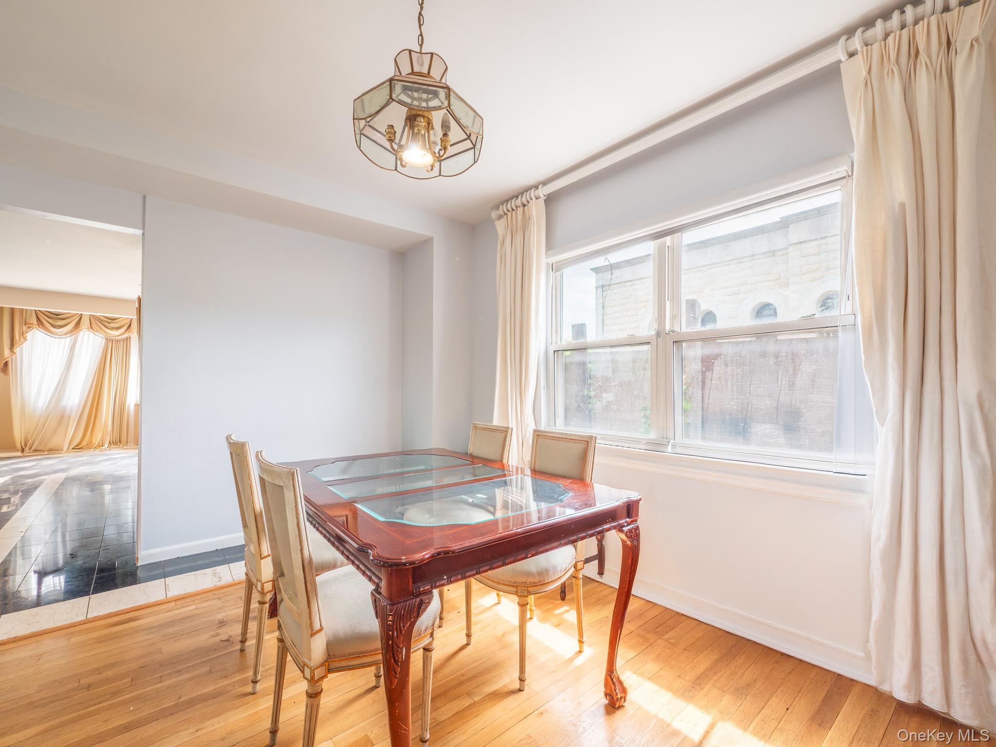 75-75 180th Street Queens, NY 11366 - Photo 9 of 48 a view of a dining room with furniture and window