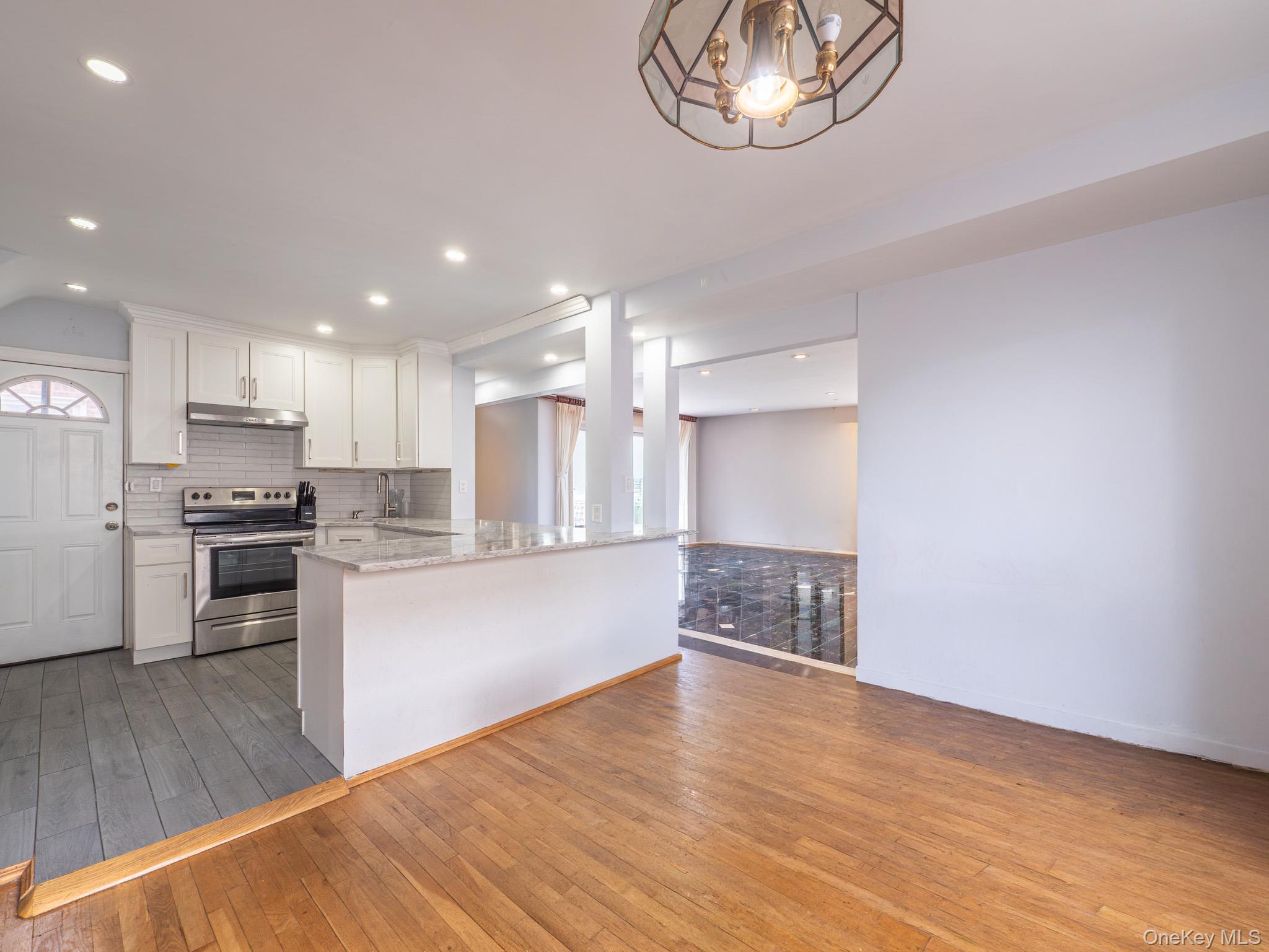 75-75 180th Street Queens, NY 11366 - Photo 10 of 48 a view of kitchen with sink and wooden floor