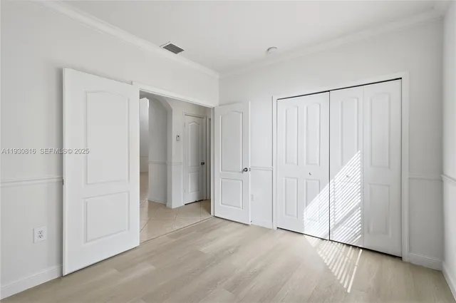 a bathroom with a sink tub double vanity and a mirror