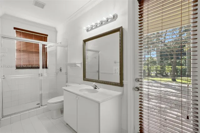 a view of a room with wooden floor and windows