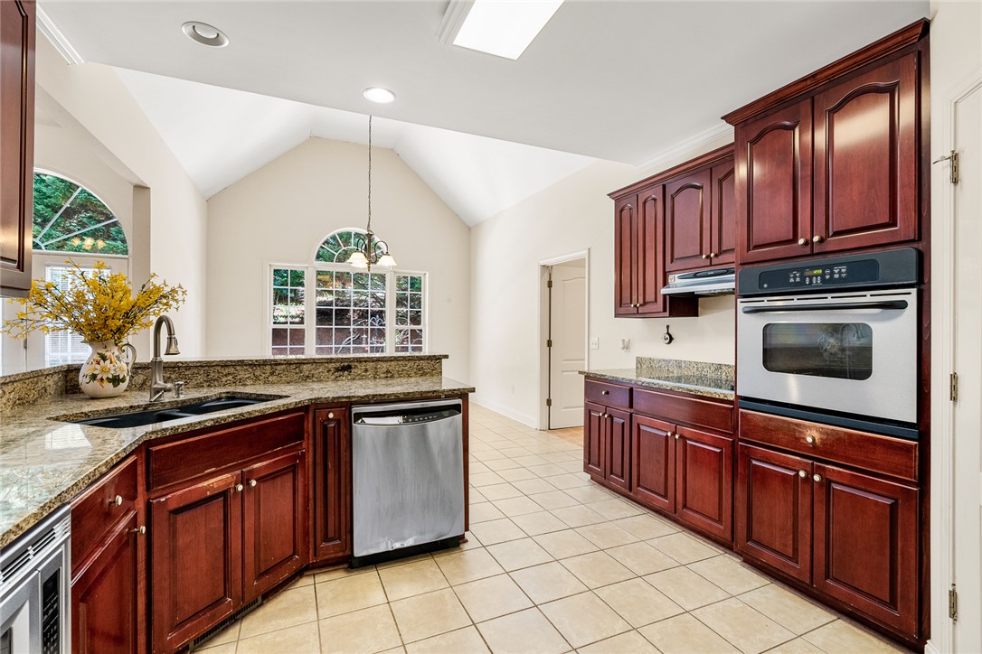 135 Sunset Bay Boulevard Seneca, SC 29672 - Photo 16 of 50 Culinary haven with soaring vaulted ceilings and abundant natural light.