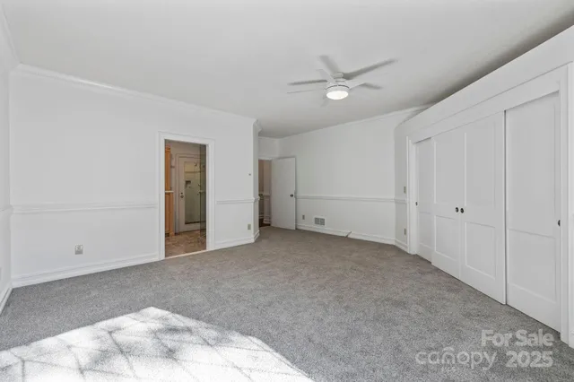 a spacious bathroom with a granite countertop sink toilet and shower