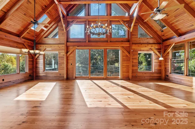 a kitchen with stainless steel appliances white cabinets and a window