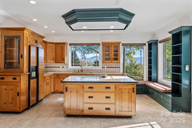 a kitchen with stainless steel appliances white cabinets and a sink