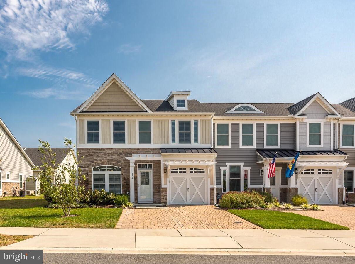 a front view of building with yard