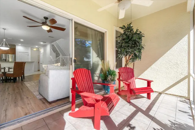 a living room filled with furniture and a potted plant