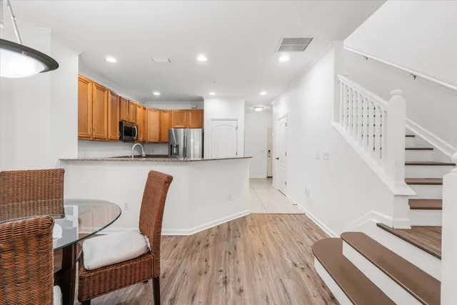 a view of kitchen with cabinets and wooden floor