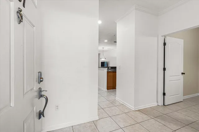 a view of a kitchen from the hallway