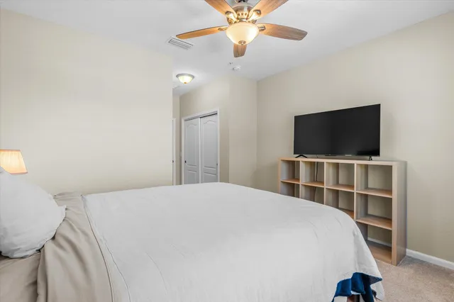 a bedroom with a flat bed and a flat screen tv