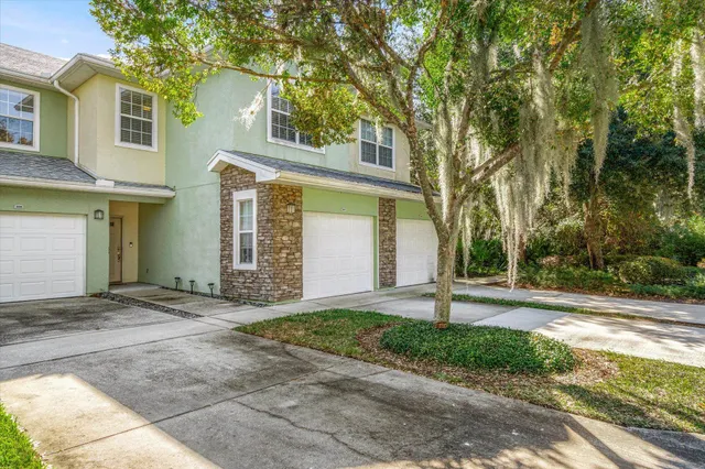 a view of a house with a door and wooden floor