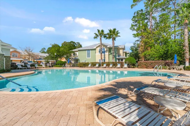 a front view of a house with a yard and a garage