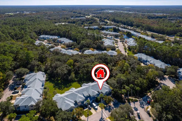 an aerial view of a house and outdoor space