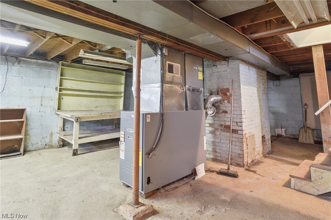7380 Tallmadge Road Rootstown, OH 44272 - Photo 23 of 23 Basement with heating utilities and brick wall