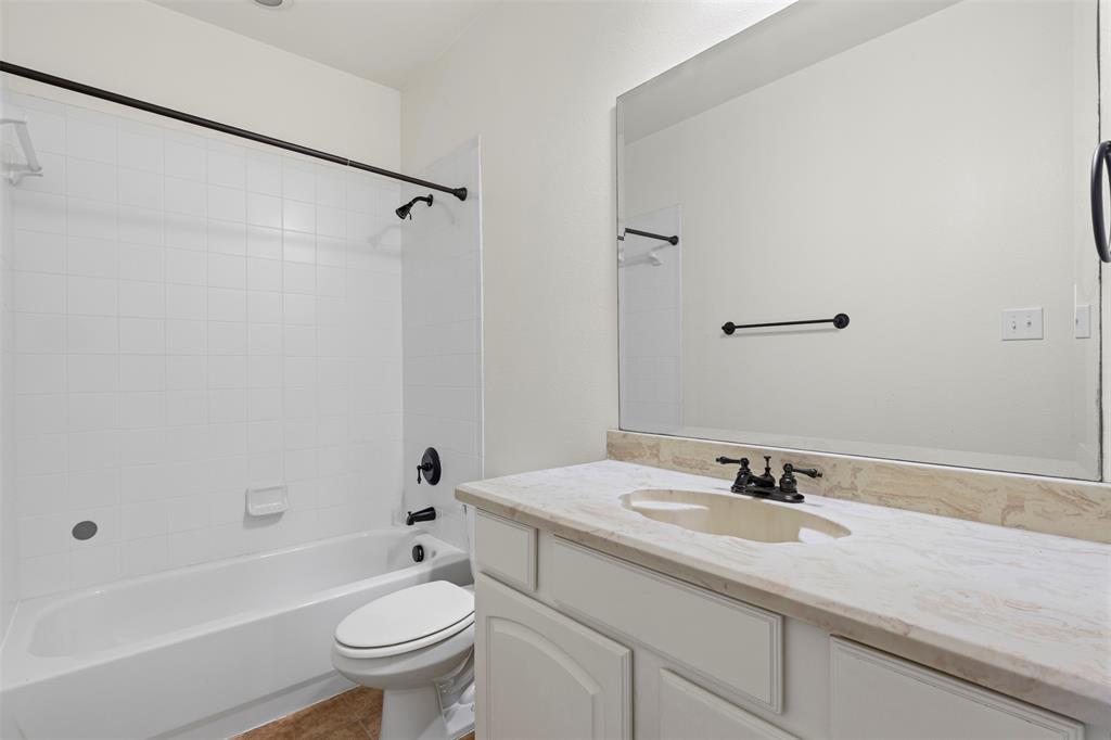 8813 Tudor Place Dallas, TX 75228 - Photo 19 of 27 a bathroom with a sink toilet and shower