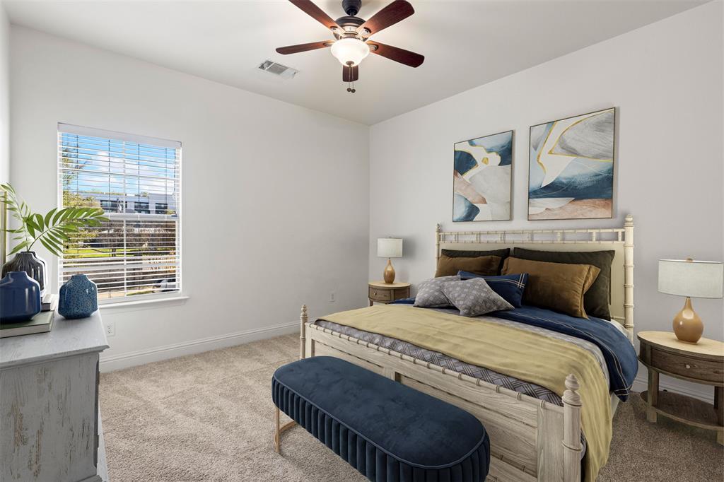 8813 Tudor Place Dallas, TX 75228 - Photo 20 of 27 a bedroom with a large bed and a window