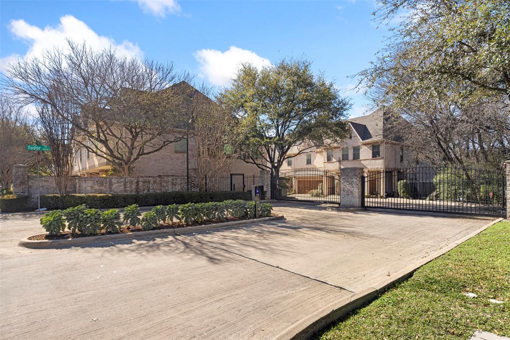 8813 Tudor Place Dallas, TX 75228 - Photo 25 of 27 a view of a white house next to a road and yard