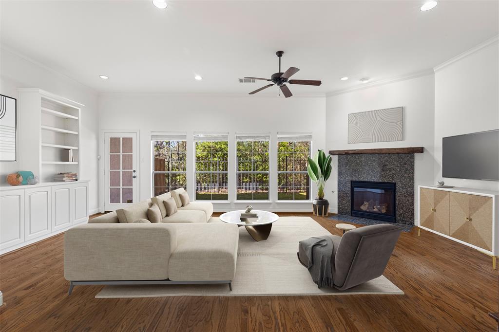 8813 Tudor Place Dallas, TX 75228 - Photo 3 of 27 a living room with furniture and a fireplace
