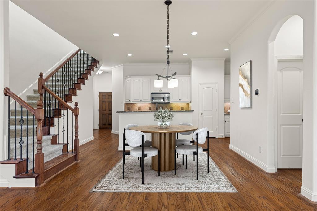 8813 Tudor Place Dallas, TX 75228 - Photo 4 of 27 a view of a dining room with furniture and wooden floor