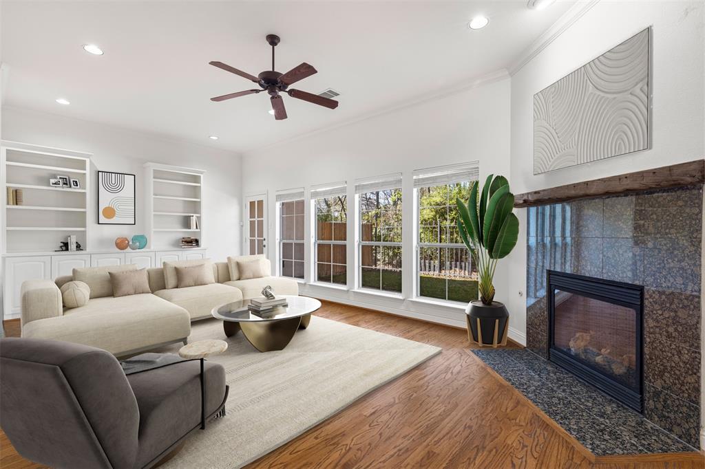 8813 Tudor Place Dallas, TX 75228 - Photo 5 of 27 a living room with furniture a floor to ceiling window and a fireplace