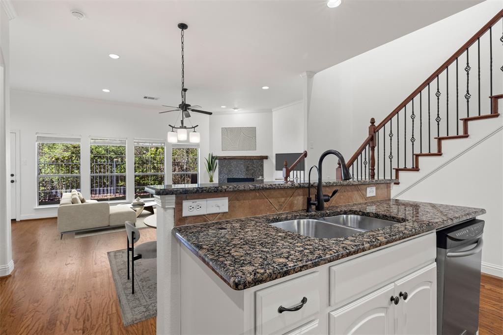 8813 Tudor Place Dallas, TX 75228 - Photo 7 of 27 a kitchen with counter top space a sink and appliances
