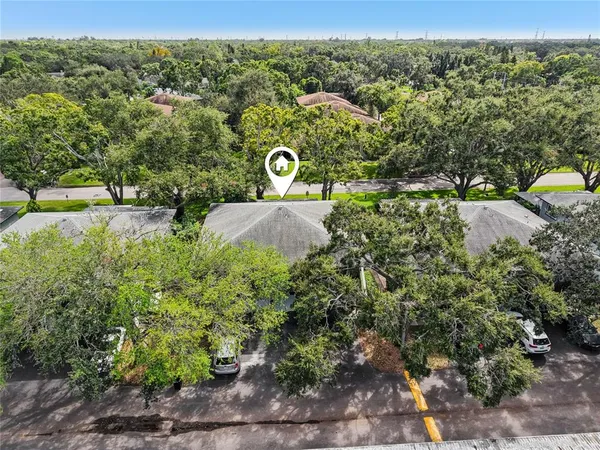 an aerial view of a house with a garden