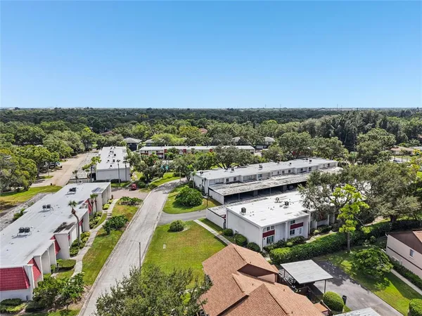 an aerial view of a house with swimming pool outdoor seating and entertaining space