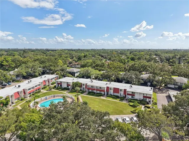 a picture of a park with an bench