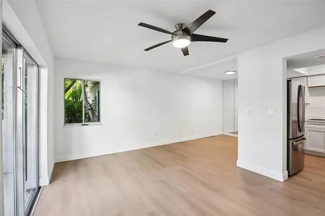 a kitchen with a sink and a refrigerator