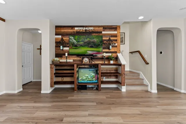 a view of a dining room with furniture window and wooden floor