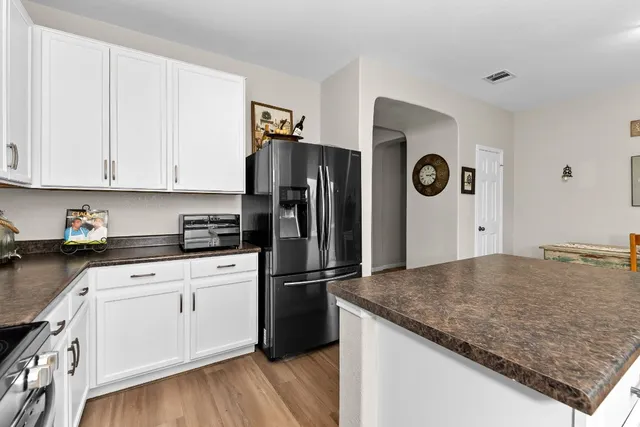 a bathroom with a toilet a sink and a mirror