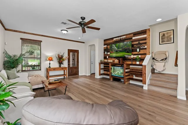 a kitchen with granite countertop a refrigerator stove top oven and sink