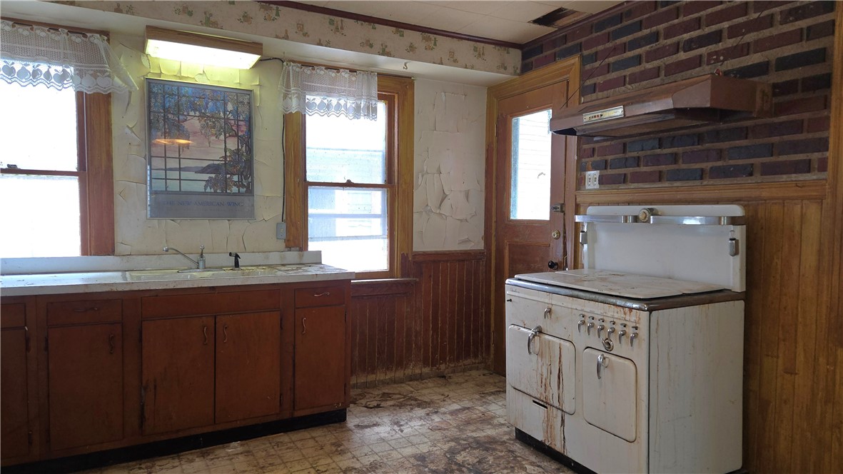 302 Field Street Rochester, NY 14620 - Photo 6 of 32 Kitchen has a door to the back yard, patio & garag