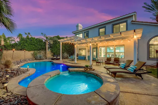 a swimming pool with outdoor seating yard and outdoor seating