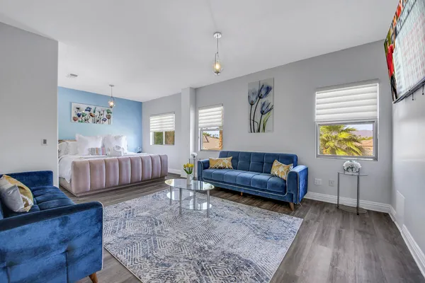 a bathroom with a tub sink and mirror
