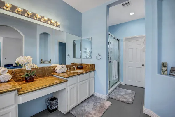 a bedroom with a bed and a table in it