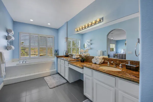 a bedroom with a bed and a table in it