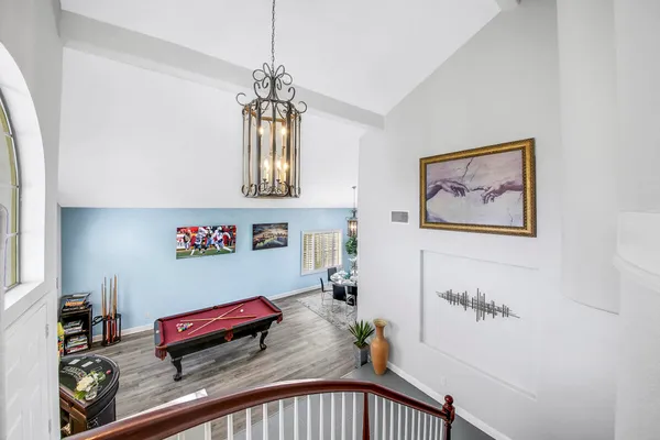a view of a patio with swimming pool table and chairs