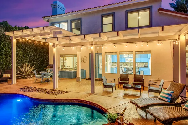 a view of a swimming pool with lounge chair