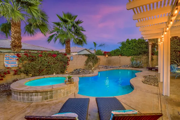 a building outdoor space with patio furniture and wooden floor