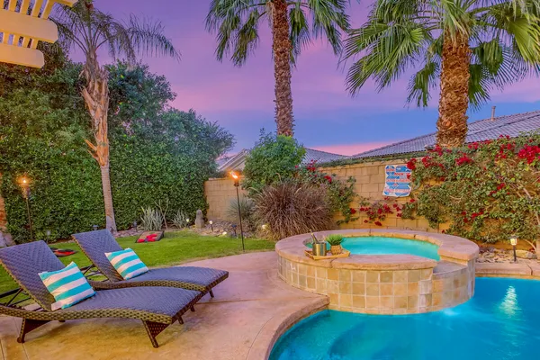 a view of a patio with a table chairs and a patio