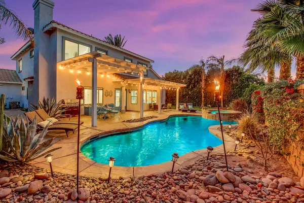 a view of a swimming pool with a patio