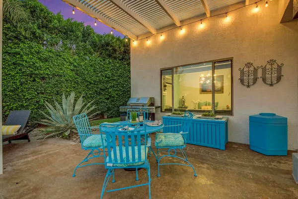 an aerial view of a house with a yard and garden